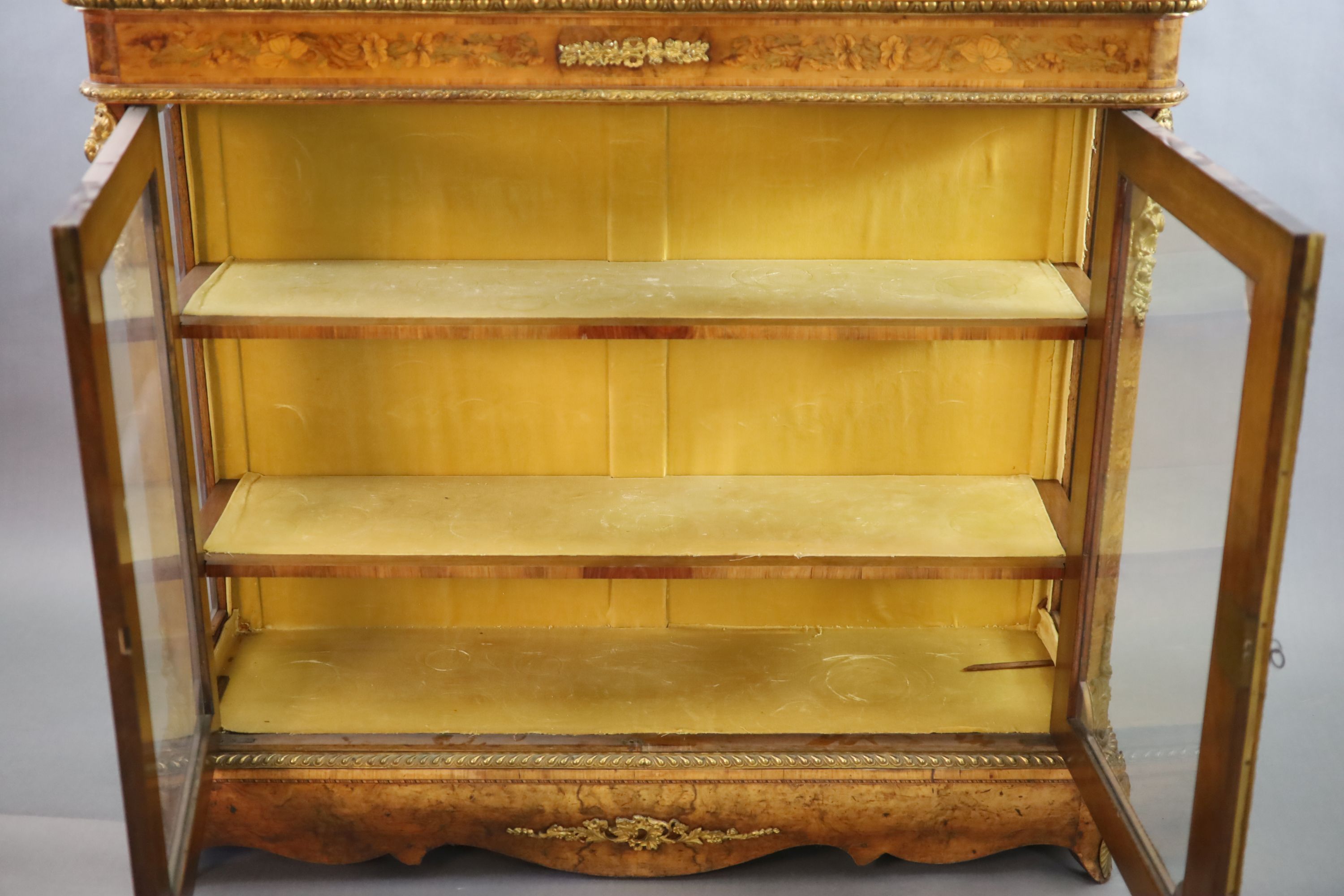 A Victorian ormolu mounted marquetry inlaid walnut bookcase, W.126cm D.38cm H.115cm